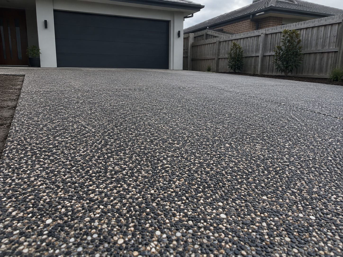 Charcoal and tan exposed aggregate driveway